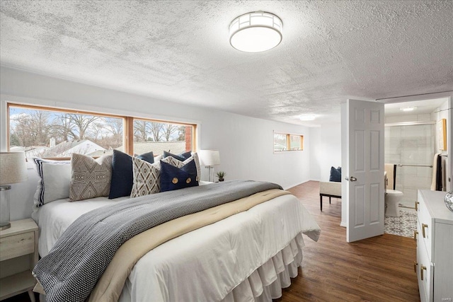 bedroom featuring a textured ceiling and dark wood-type flooring