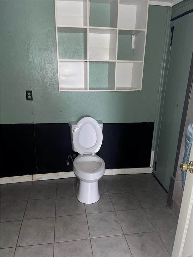 bathroom featuring tile patterned floors and toilet