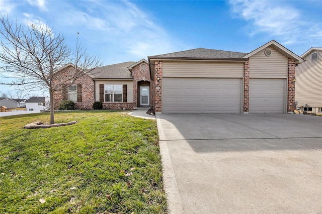 view of front of home with a garage and a front lawn