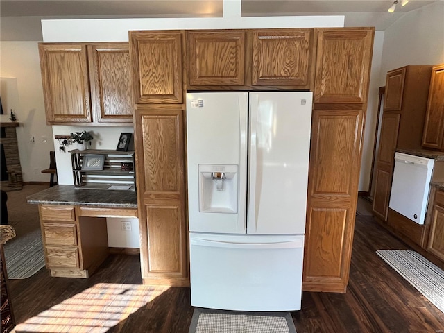 kitchen with dark wood-type flooring and white appliances