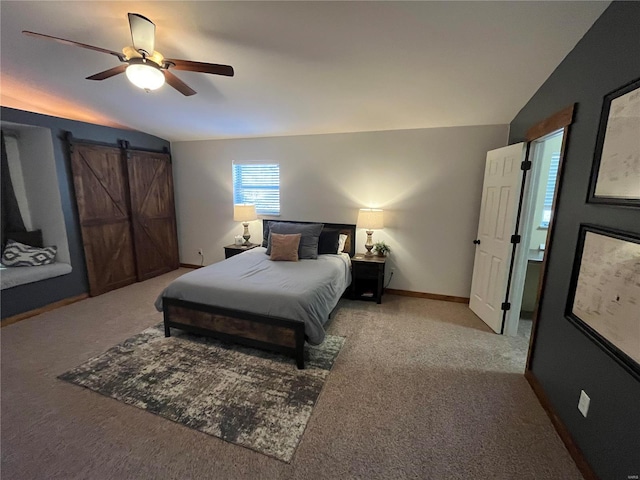 carpeted bedroom featuring lofted ceiling and ceiling fan