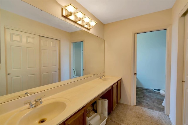 bathroom with vanity and toilet