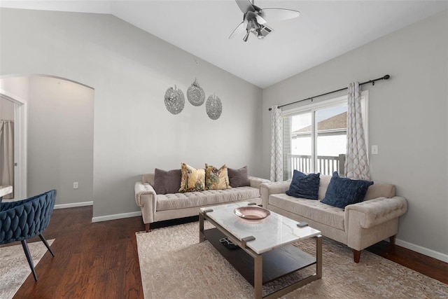 living room featuring lofted ceiling, dark hardwood / wood-style flooring, and ceiling fan