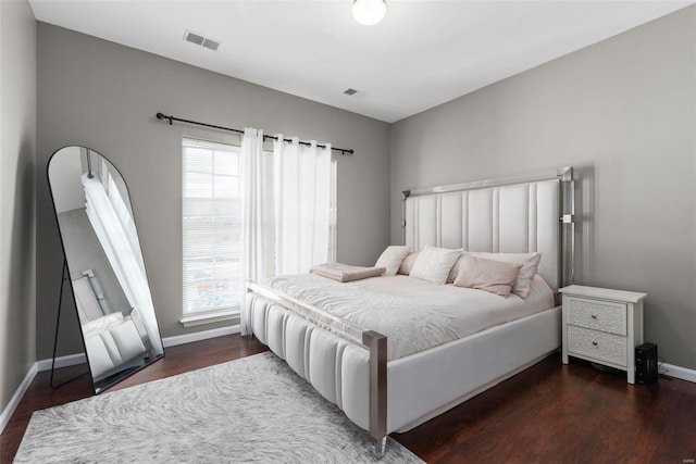 bedroom featuring dark wood-type flooring