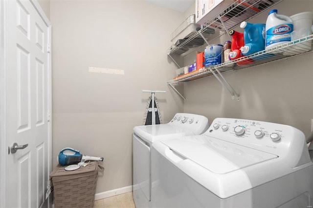 clothes washing area with washing machine and clothes dryer