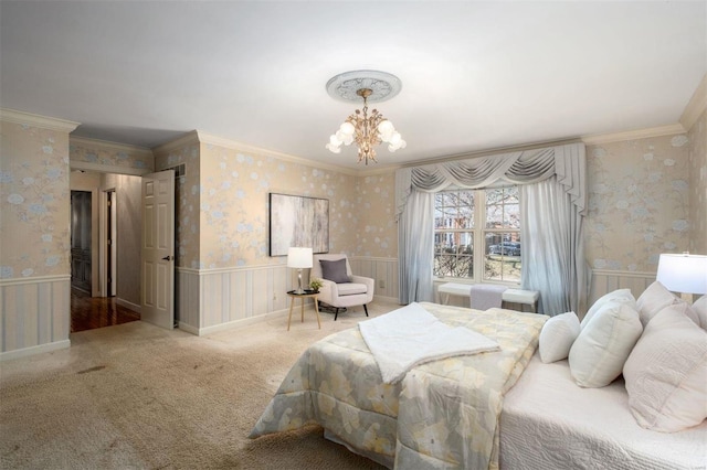 bedroom featuring a wainscoted wall, carpet, an inviting chandelier, and wallpapered walls