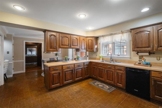 kitchen featuring a sink, recessed lighting, crown molding, light countertops, and dishwasher