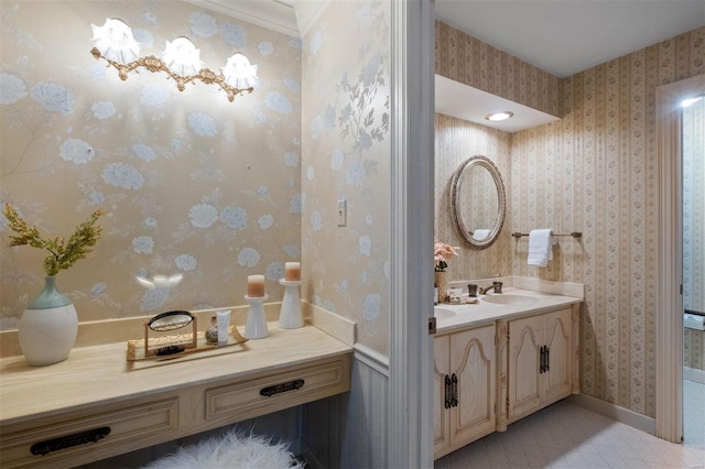 bathroom featuring wallpapered walls and vanity