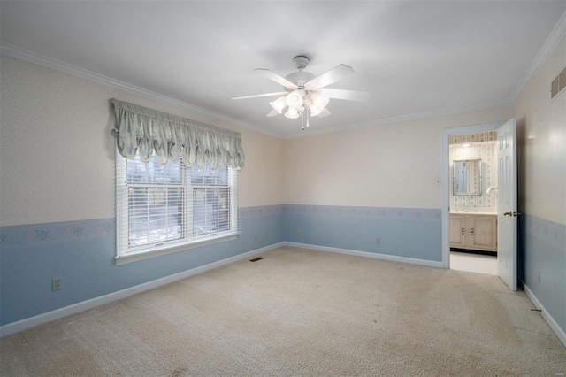 unfurnished room with crown molding, light colored carpet, baseboards, and ceiling fan