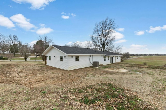 rear view of property with cooling unit