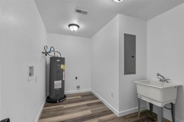 washroom with washer hookup, water heater, hookup for an electric dryer, laundry area, and electric panel