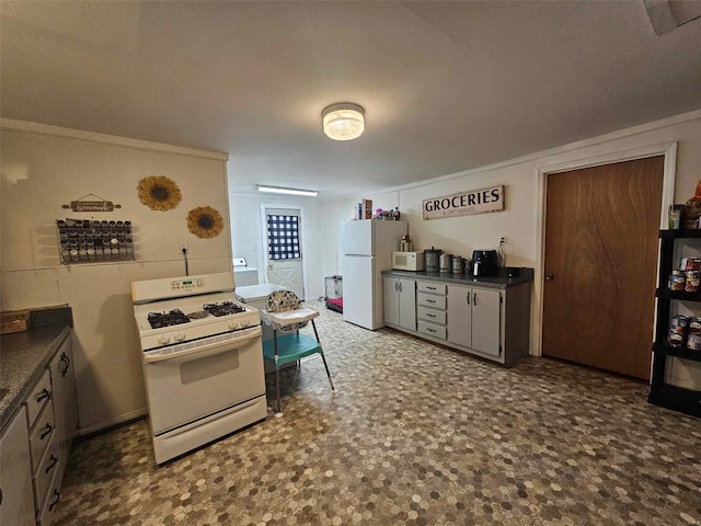 kitchen with white appliances and ornamental molding