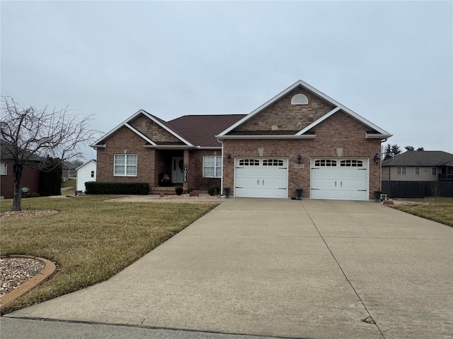 view of front of property with a garage and a front lawn