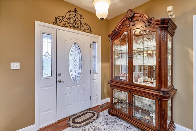 entrance foyer with hardwood / wood-style floors