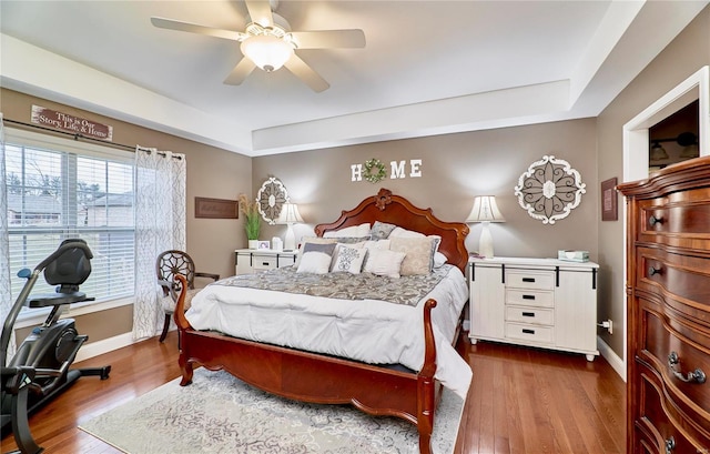 bedroom featuring hardwood / wood-style flooring and ceiling fan