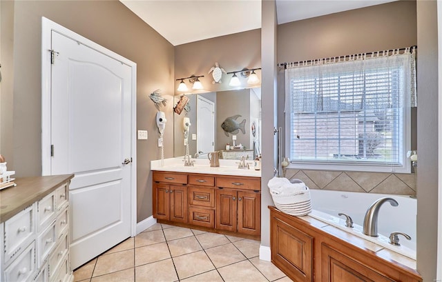 bathroom featuring tile patterned flooring, a bathing tub, and vanity