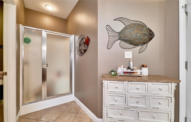 bathroom featuring walk in shower and tile patterned floors