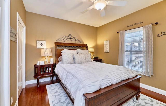 bedroom featuring dark wood-type flooring and ceiling fan