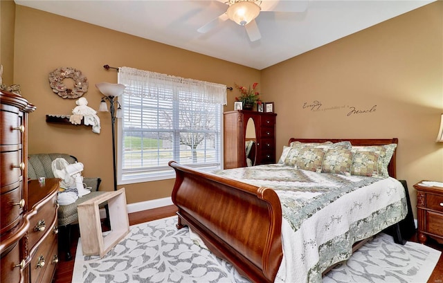 bedroom with ceiling fan and light hardwood / wood-style flooring