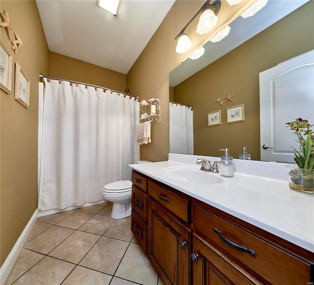 bathroom with vanity, toilet, and tile patterned flooring