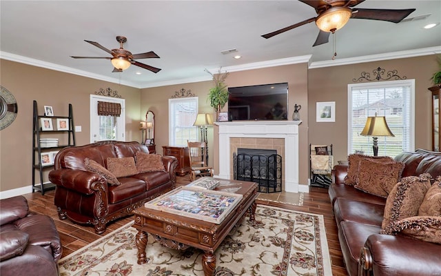 living room featuring crown molding, dark hardwood / wood-style floors, and ceiling fan