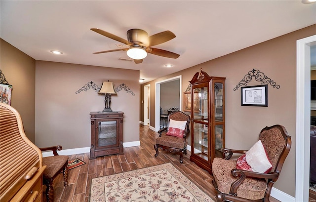 sitting room featuring ceiling fan