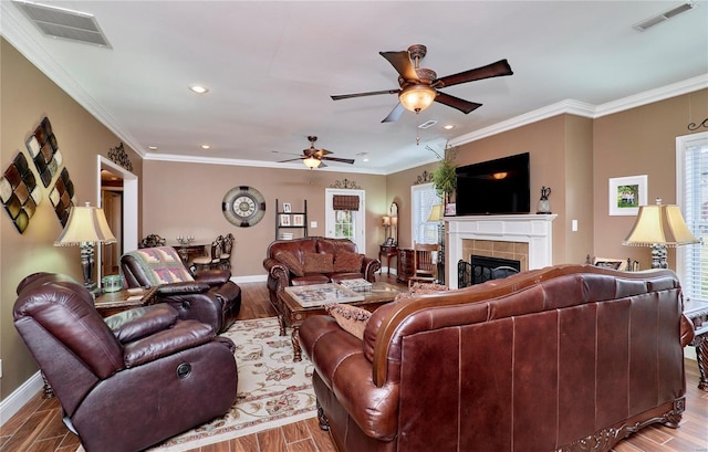 living room with hardwood / wood-style flooring and ornamental molding