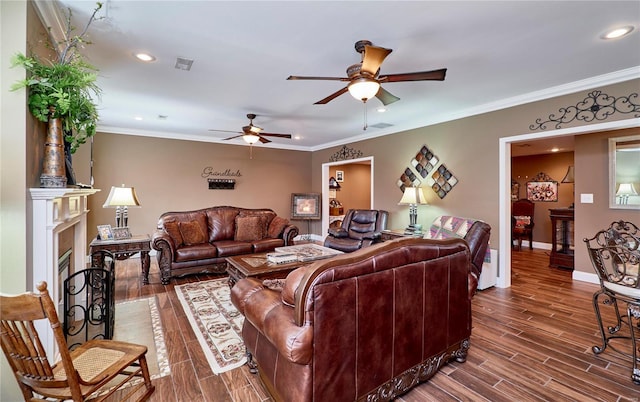 living room with crown molding and ceiling fan