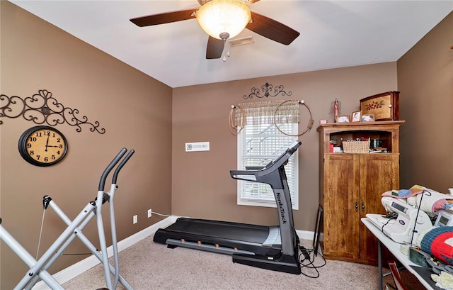 workout room with carpet and ceiling fan