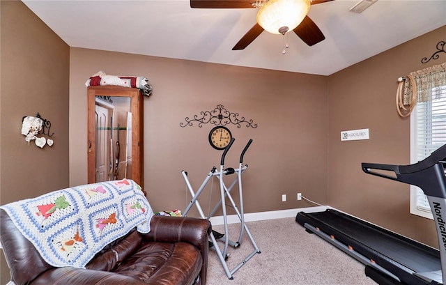 exercise area featuring carpet and ceiling fan