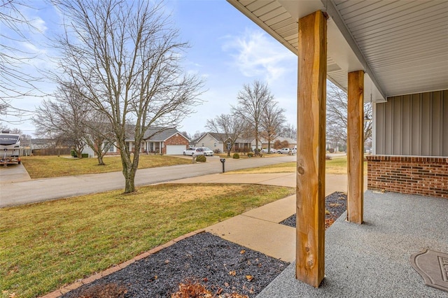 view of yard with covered porch