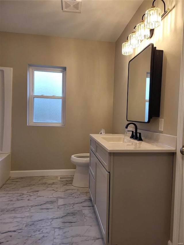 full bath featuring marble finish floor, vanity, visible vents, and baseboards