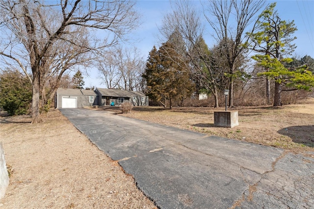 ranch-style home featuring a garage