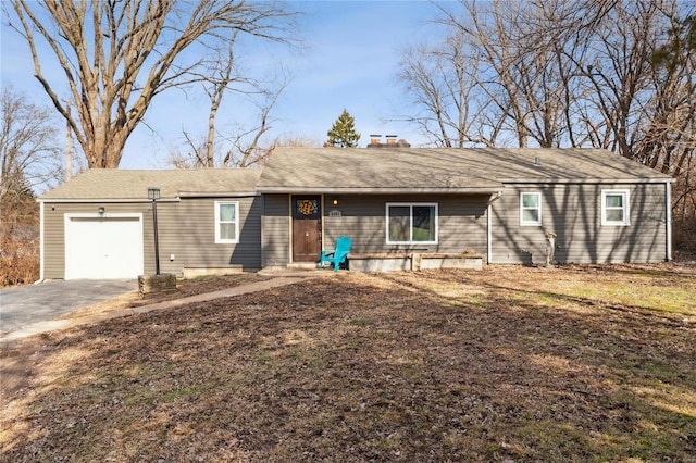 ranch-style home featuring a garage