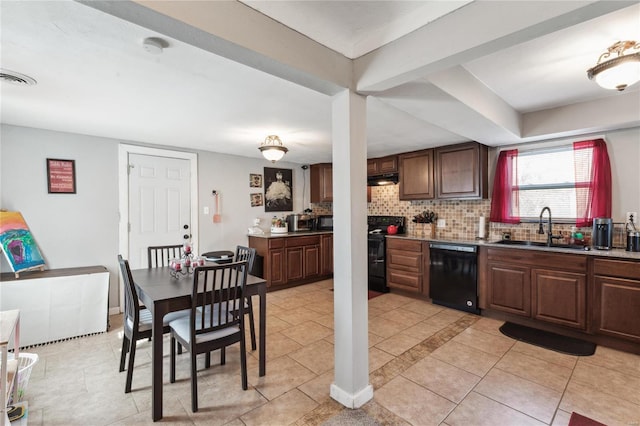 kitchen featuring backsplash, light tile patterned flooring, sink, and black appliances