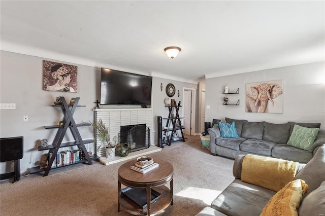 carpeted living room featuring a fireplace