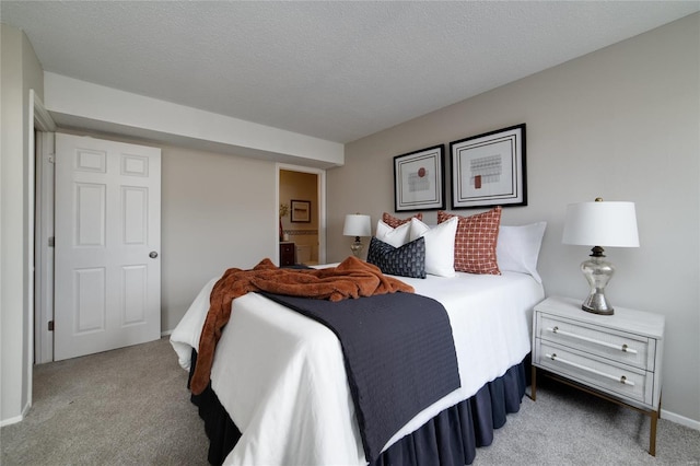 carpeted bedroom with a textured ceiling