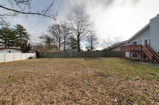 view of yard featuring a wooden deck