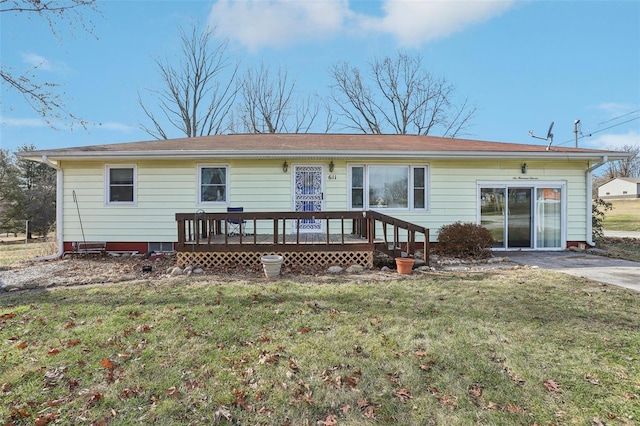 back of house with a yard and a deck