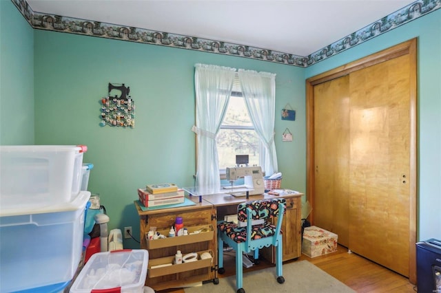 home office with wood-type flooring