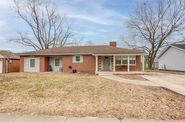 ranch-style house featuring a front yard and a porch