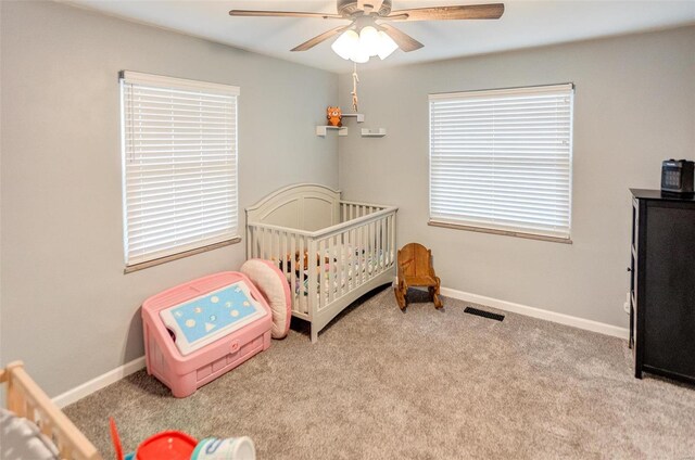 bedroom with ceiling fan and light colored carpet