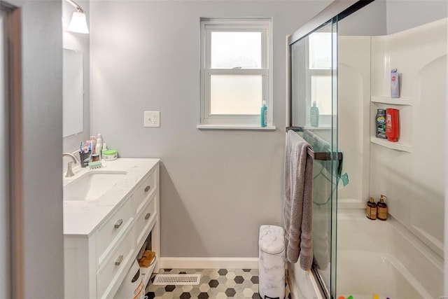 bathroom featuring vanity and walk in shower