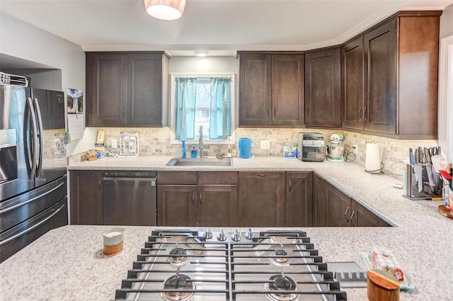 kitchen with stainless steel appliances, sink, and backsplash