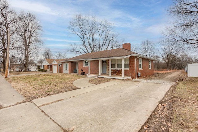 ranch-style house with a garage and a front yard