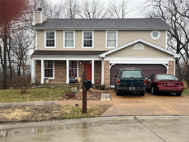 view of front of property with a garage