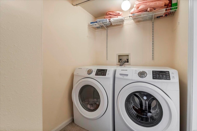 laundry room featuring laundry area, independent washer and dryer, and baseboards