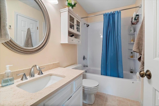 bathroom with tile patterned flooring, toilet, vanity, and shower / bath combination with curtain