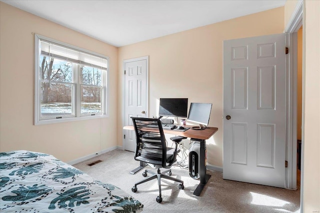 bedroom with visible vents, baseboards, and light colored carpet