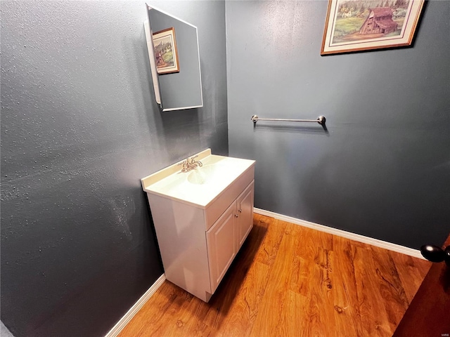 bathroom featuring vanity and hardwood / wood-style floors